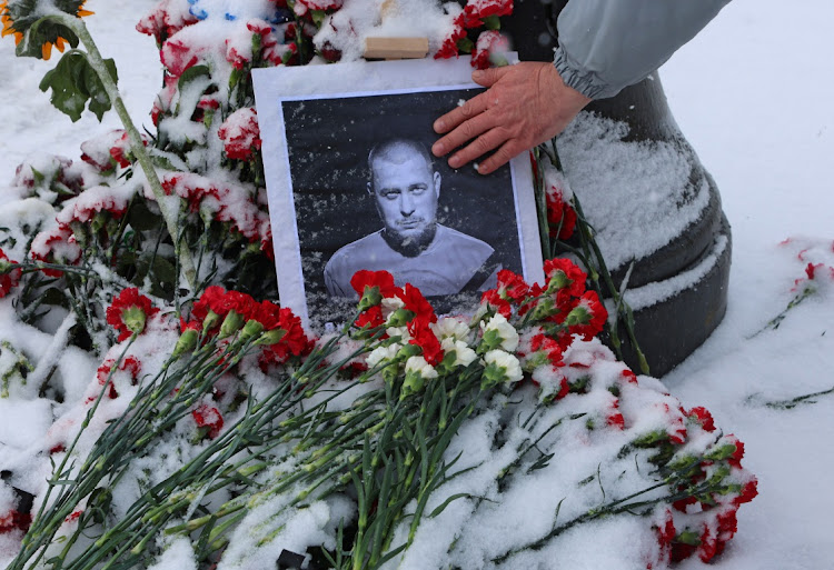 A portrait of Russian military blogger Vladlen Tatarsky, (real name Maxim Fomin), who was killed in the cafe explosion, is placed among flowers near the blast site in Saint Petersburg, Russia, on April 3 2023. Picture: REUTERS/ANTON VAGANOV