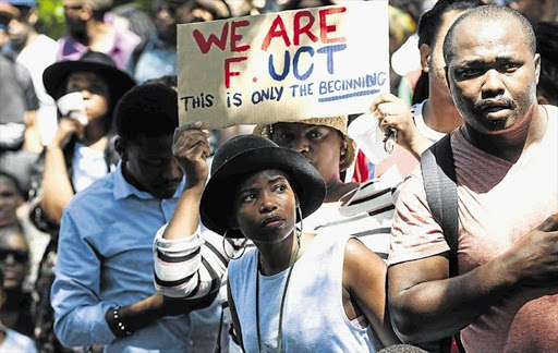 SPELL CHECK: University of Cape Town students march on the Rondebosch police station to demand the release of fellow students arrested earlier in the day, following a continuation of the counrtywide protests against tuition fee increases Image by: David Harrison