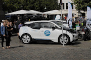 A BMW i3 electric car is seen parked on a busy street in Copenhagen, Denmark. 