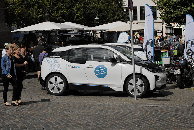 A BMW i3 electric car is seen parked on a busy street in Copenhagen, Denmark.