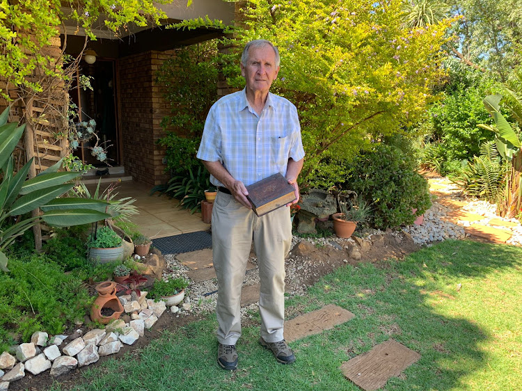 Jannie Groenewald, one of the founding members of Kleinfontein, outside his home with the Schat-Boeck.