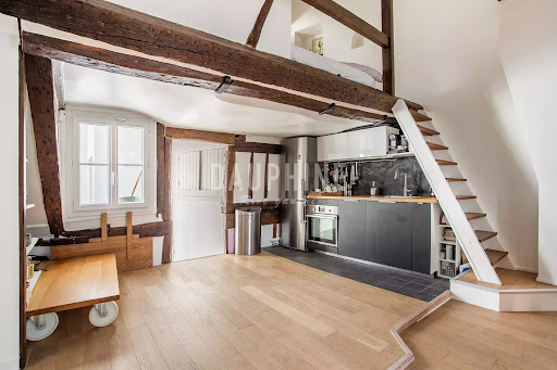 Open kitchen with exposed beams in this luxury apartment / penthouse for sale in Paris 5ème ($753,223 - 53 m²)
