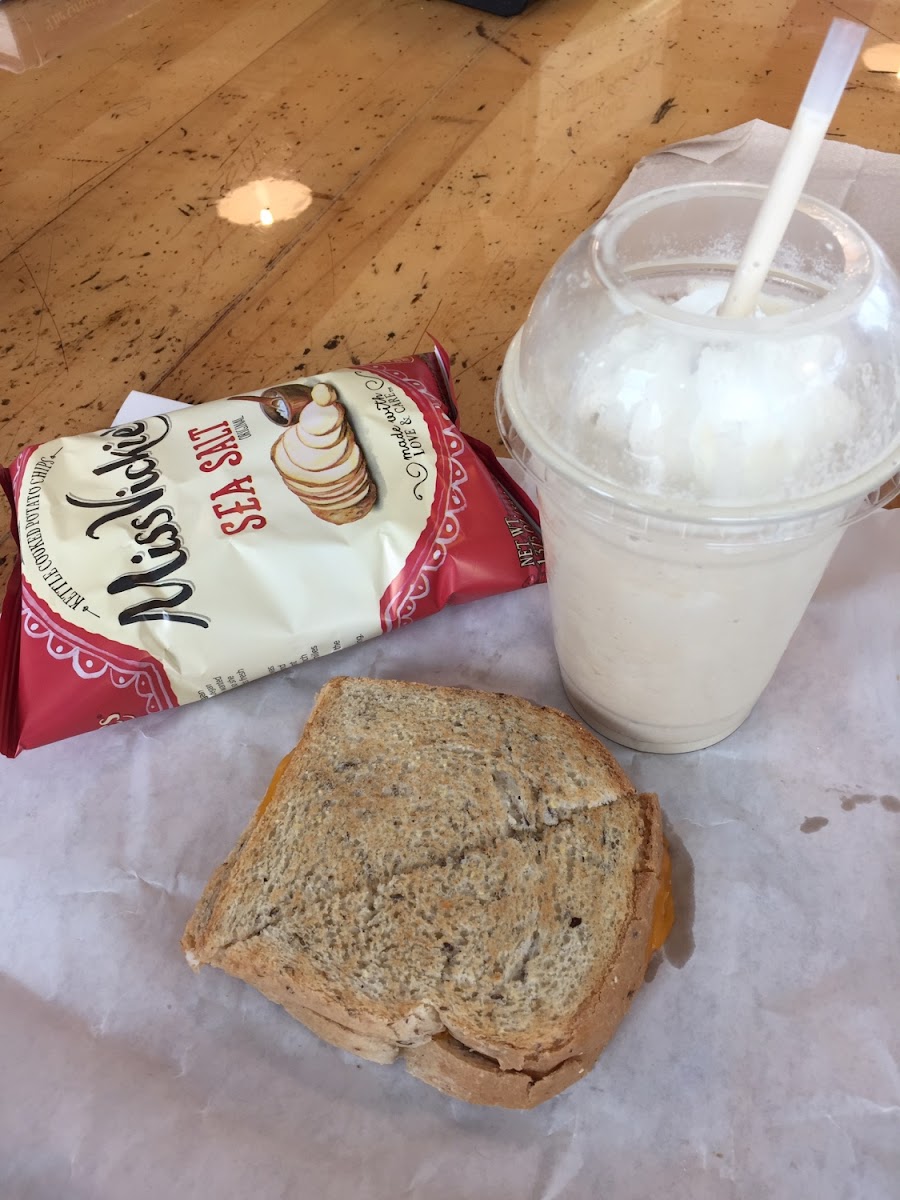 Grilled cheese on gluten free bread along with kettle chips and an espresso shake