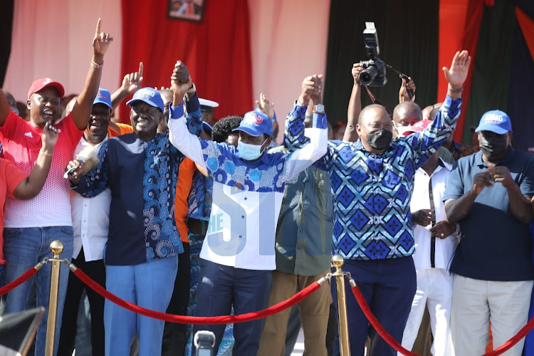 ODM party leader Raila Odinga, Wiper leader Kalonzo Musyoka and President Uhuru Kenyatta at Azimio rally at Jacaranda grounds in Nairobi on March 12, 2022.