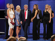 Donald Trump walks off stage as (from left to right) Eric Trump, Lara Yunaska, Vanessa Trump, Melania Trump, businessman Jared Kushner, Ivanka Trump and Vanessa Trump look on after the third U.S. presidential debate on October 19, 2016 in Las Vegas.