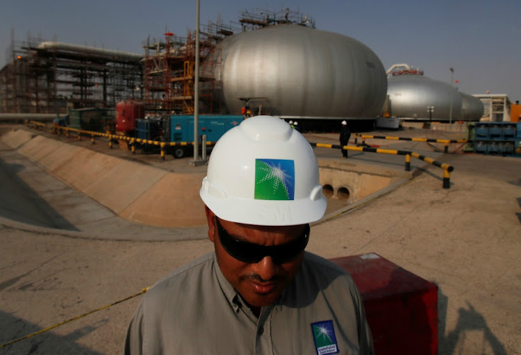 An employee in a branded helmet is pictured at Saudi Aramco oil facility in Abqaiq, Saudi Arabia October 12, 2019. REUTERS/MAXIM SHEMETOV