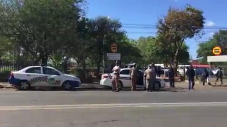 Police stand outside the Pietermaritzburg high court on Friday where judgment was delivered on former president Jacob Zuma's bid to avoid prosecution.