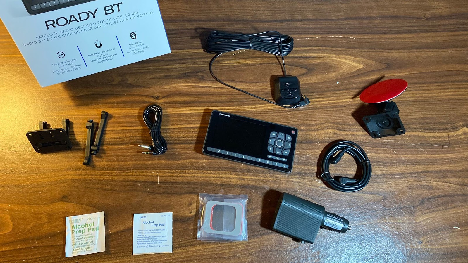 Unboxing of the Roady BT satellite radio, with all the parts laid out over a desk