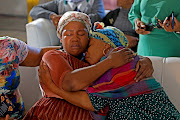 Monica Matsie, right, and a relative at the Mahube A Tumelo hall in Bloemfontein, where her son Katlego Bereng’s memorial service was held on Thursday May 4 2023. 