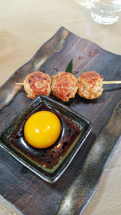 Afuri PDX Tsukune with minced chicken thigh, ginger, onion, yam, potato, egg yolk, Oregon piot noir yakitori