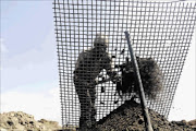 WORKING HARD: SS Ngcobo has been mining coal  since 1976. He has now turned to making  bricks of mining soil from the opencast mine