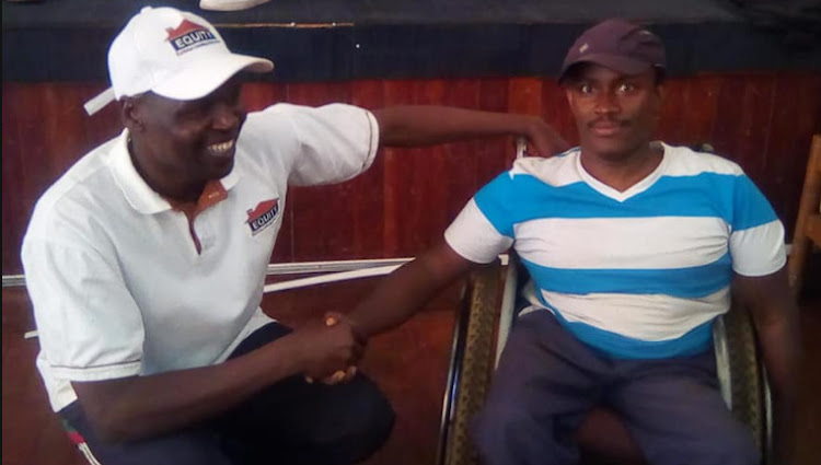 Sadam Ali Sheikh (R) is congratulated buy Chess Kenya president Bernard Wanjala (Left) after winning the inaugural Kenya National Chess Championship for People Living with Disability in October 2019.