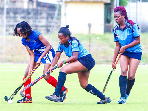 Strathmore Nancy Wanjue battles for the ball against Jkuat’s Mary Njoki /ENOS TECHE