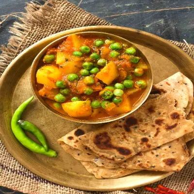 Aloo Matar Dry (200Ml) + Plain Paratha 2Pcs