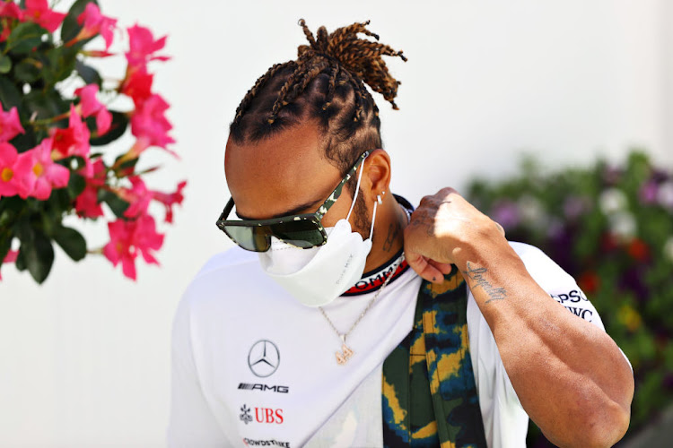 Lewis Hamilton walks in the paddock during previews ahead of the F1 Grand Prix of Spain at Circuit de Barcelona-Catalunya on May 6 2021 in Barcelona, Spain.