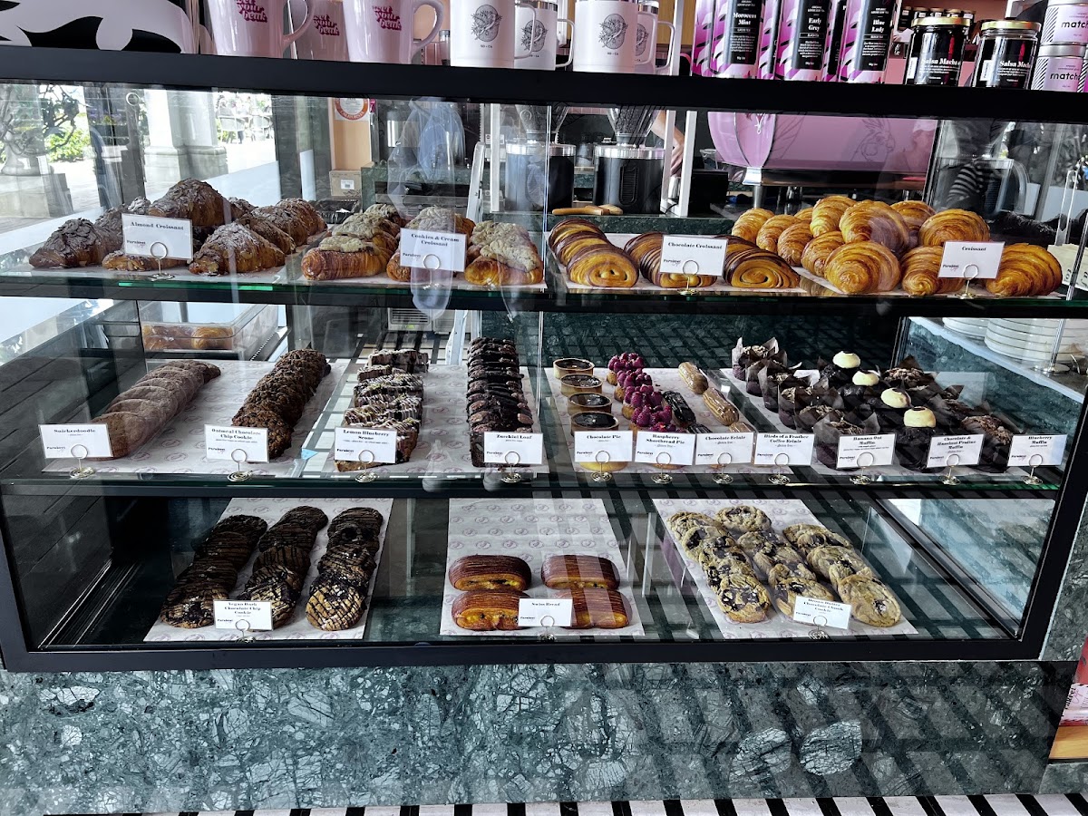 Pastry cabinet.  Second row filled with GF treats.  Cookies, muffins, loaves, eclairs!