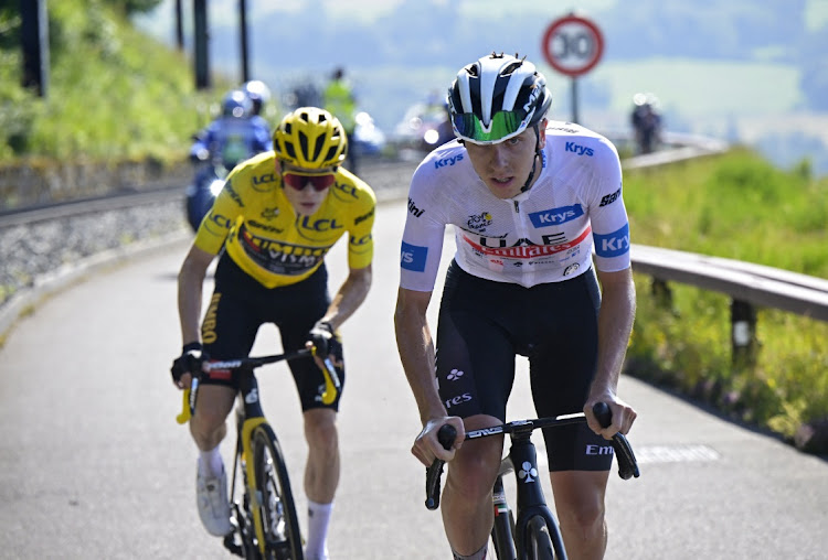 UAE Team Emirates' Tadej Pogacar and Team Jumbo–Visma's Jonas Vingegaard in action during stage 9 of the Tour de France from Saint-Leonard-De-Noblat to Puy De Dome, France on July 9 2023. Pool via REUTERS/Papon Bernard