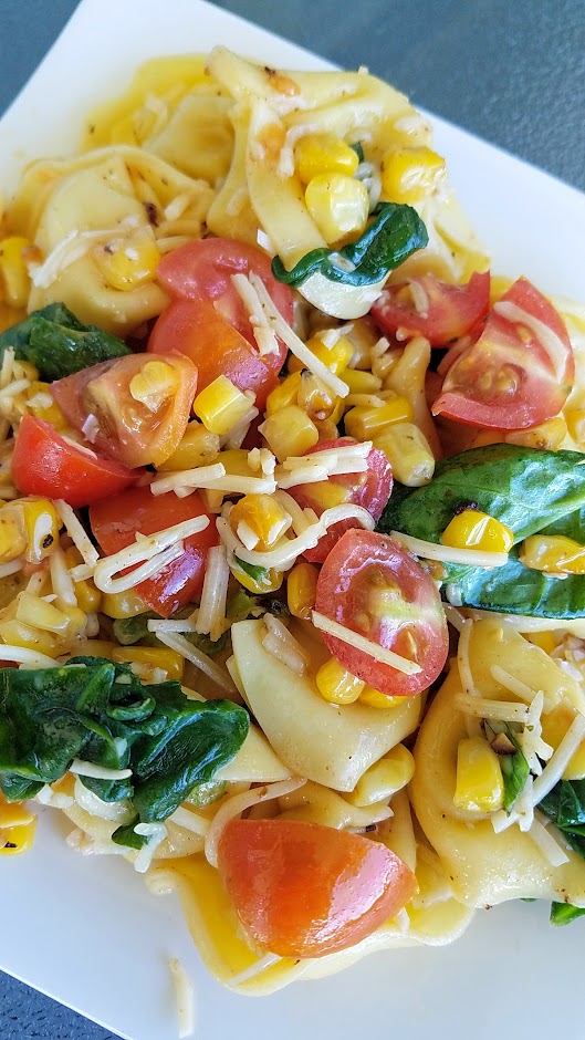 Tortellini Corn and Tomatoes Salad recipe, an easy summer recipe that takes advantage of the fresh taste of summer corn while its sweet and heirloom tomatoes at their juiciest and is perfect for a picnic, potluck, and can be served cold or room temperature