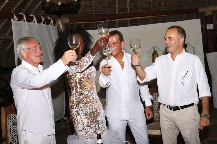 Brono Boschi, Akothee, Massimo and Bruno share a toast