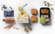 New from Woolworths, from left: carrot juice, freeze-dried blueberries, passion fruit lamington dessert, ultimate roosterkoek, and butter curry.