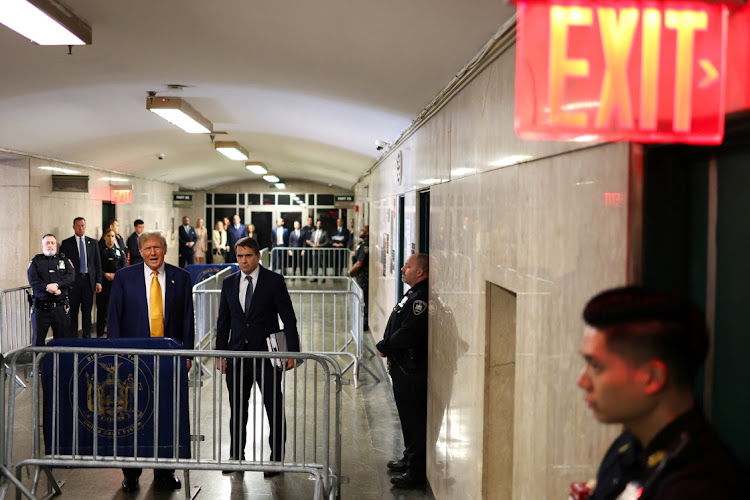 Former US president Donald Trump speaks to the press at the Manhattan Criminal Court in New York on Thursday before his trial for allegedly covering up hush money payments linked to extramarital affairs. Picture: CHARLY TRIBALLEAU/REUTERS