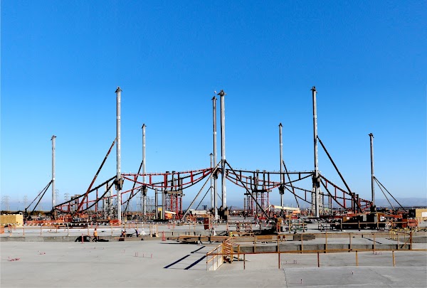 The beginning stages of construction showing the support columns that hold the roofing in place.