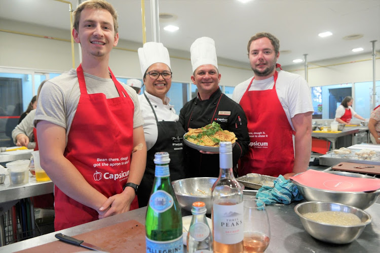 Enjoying a mastercalss are, from left, Dayne van Staden, Capsicum chef Nadia Pillay, chef Donovan Miller and Corne Kleynhans. Participants enjoyed an American-themed cooking masterclass hosted at the Capsicum Culinary Studio in November