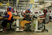 Workers sew clothes inside the Indochine Apparel textile factory in Hawassa Industrial Park in Ethiopia. 