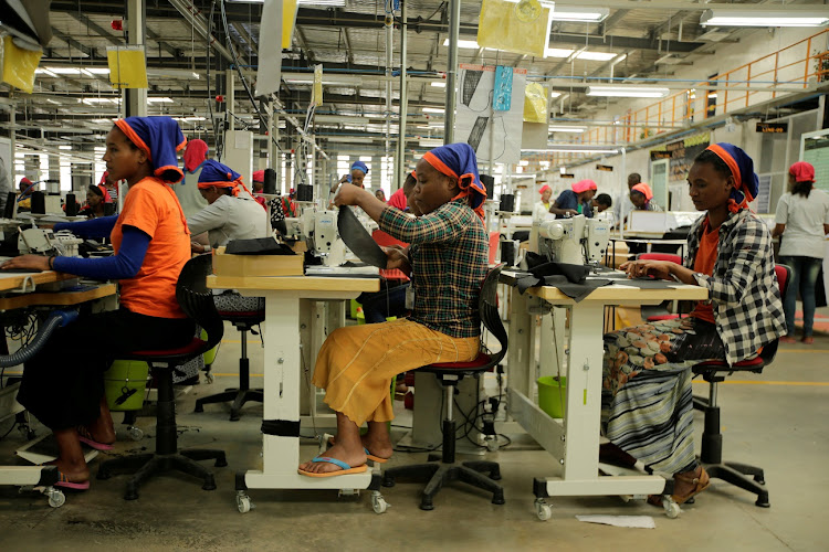 Workers sew clothes inside the Indochine Apparel textile factory in Hawassa Industrial Park in Ethiopia.