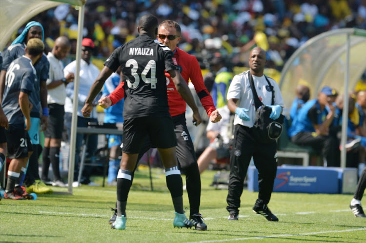 Orlando Pirates' head coach Milutin Serdojevic celebrates with Ntsikelelo Nyauza after the defender scored the opening goal during the Absa Premiership match against Mamelodi Sundowns at Loftus Versfeld Stadium on January 13, 2018 in Pretoria, South Africa. Pirates won 3-1.