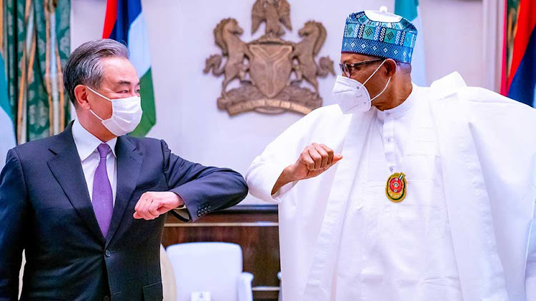 Chinese Foreign Minister Wang Yi with Nigerian President Muhammadu Buhari in January 2021 when he toured Africa for one week, visiting five countries. He also visited Democratic Republic of the Congo, Tanzania, Botswana, and The Seychelles.