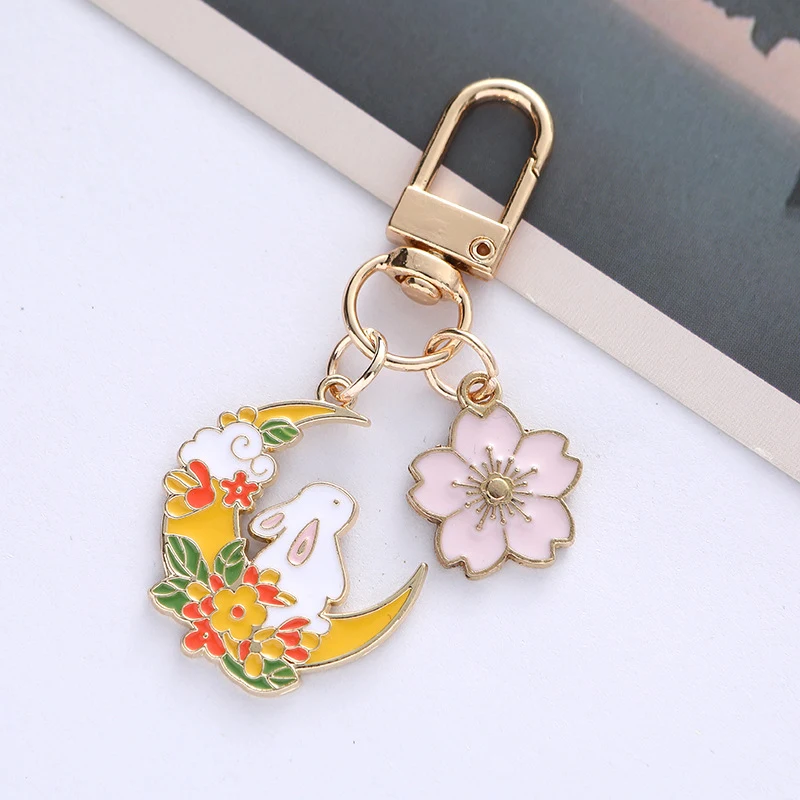 Pendentif Porte-clés Lapin Lunaire Mignon Fleur de Cerisier. Accessoire adorable pour clés, sacs. Cadeau parfait et original pour tous.