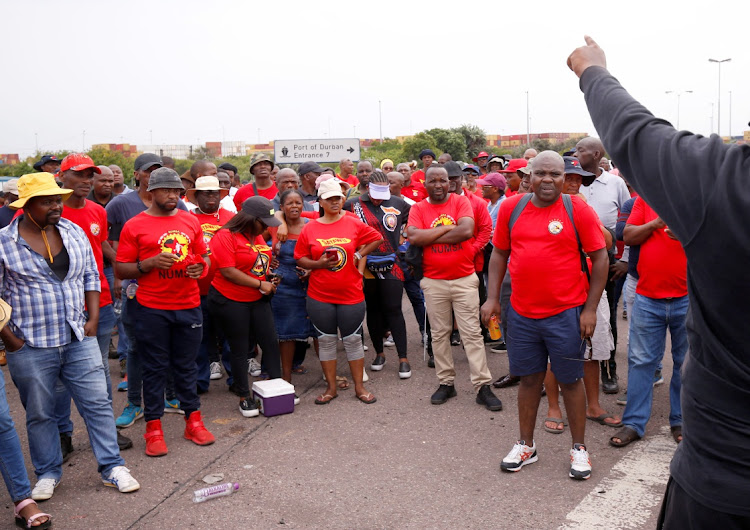 Transnet workers protest as a labour strike continues at an entrance to the harbour in Durban, South Africa, on October 17, 2022. Labour union Untu has signed a wage agreement with the firm.