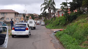 The scene on Taurus Street in Shallcross, south of Durban, where two men were beheaded and their bodies burnt on Monday. 