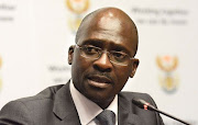 Home Affairs Minister Malusi Gigaba blames power interruptions and Telkom lines for slow service delivery.
