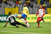 Lebohang Maboe of Mamelodi Sundowns scores past La Masia goalkeeper Cuewn Prince in their Nedbank Cup last 32 match at Dobsonville Stadium on Tuesday night. 