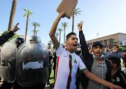 A demonstrator gestures during a protest against Covid-19 vaccine passes in Rabat, Morocco, on October 31 2021. Tough restrictions are taking a toll on Morocco's key tourism industry. File photo.