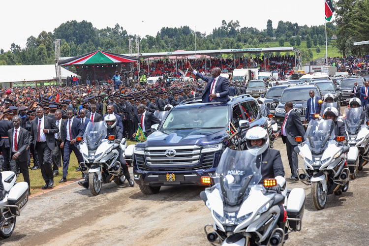 President William Ruto waving at Kericho residents as he leaves Kericho Green Stadium after the Mashujaa celebrations on October 20, 2023