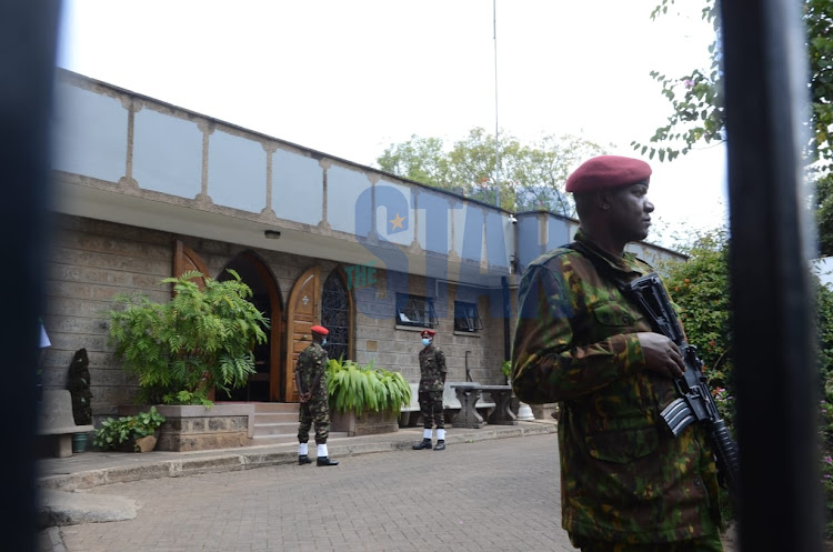 Military officials are seen at Lee Funeral Home, Nairobi on April 22, 2022.