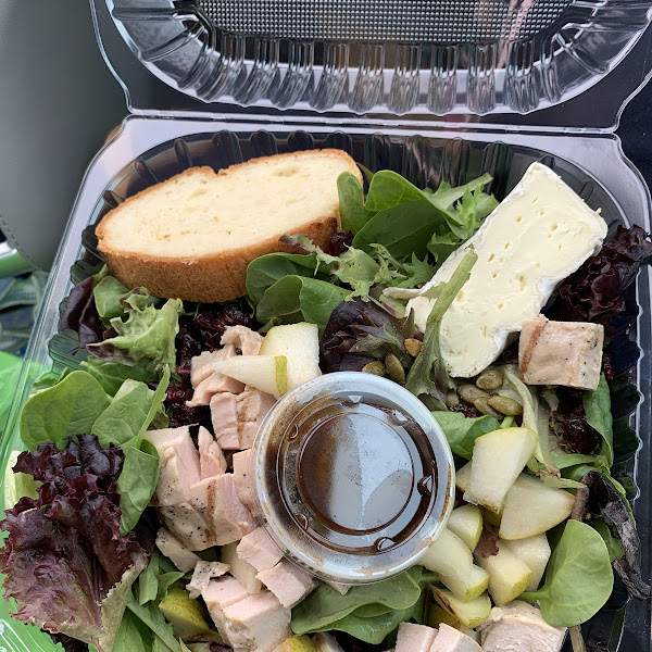 Salad of greens wirh pumpkin seeds, cranraisins, pears, large piece of brie and soft bread and added on chicken. Fig balsalmic dressing. By far the best salad i have gotten for take our.