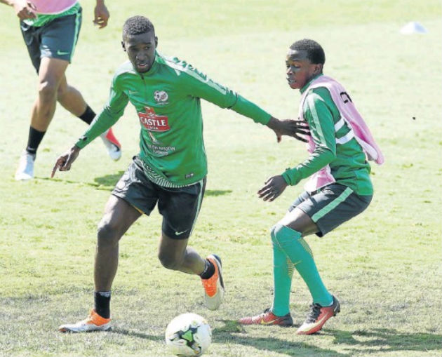 Siyanda Xulu, left, and Siphesihle Ndlovu practise their moves during the Bafana Bafana training session at the Princess Magogo Stadium in Durban before Saturday’s Libya game