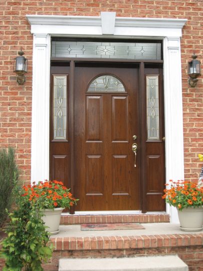 A brown entry door replacement by Unified Home Remodeling on Long Island came in at the estimated project cost.