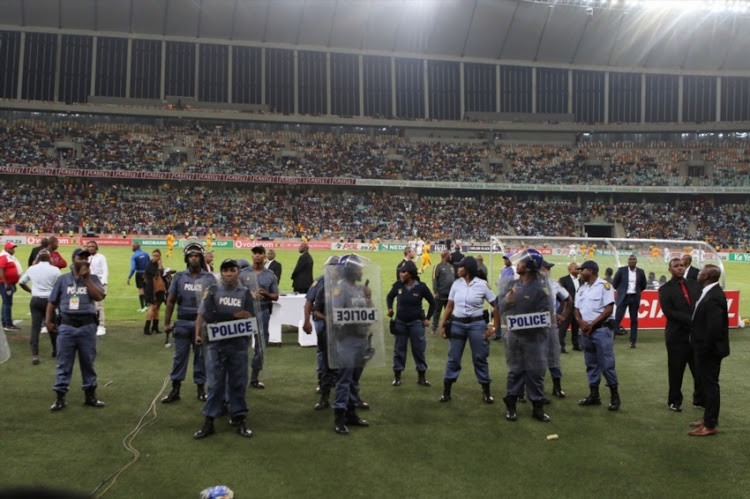 Police and stadium security were overrun as fans invaded the pitch during the Nedbank Cup semifinal between Kaizer Chiefs and Free State Stars at Moses Mabhida Stadium on April 21, 2018 in Durban.