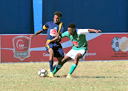 Thamsanqa Mthimkhulu of Gauteng gets the better of a Free State player in  the SAB U21 Champs at King Zwelithini Stadium yesterday. 