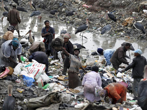 Trucks transporting garbage drive to the Dandora dumping site on the outskirts of Kenya's capital Nairobi June 5, 2015. The dumping site was declared a health hazard for the neighbouring population in 2001 but chemical, hospital, industrial, agricultural and domestic waste are still dumped here and left unprocessed. Friday marks the annual World Environment Day. REUTERS/Thomas Mukoya