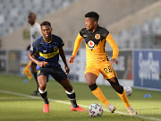 Dumisani Zuma of Kaizer Chiefs is challenged by Thato Mokeke of Cape Town City.