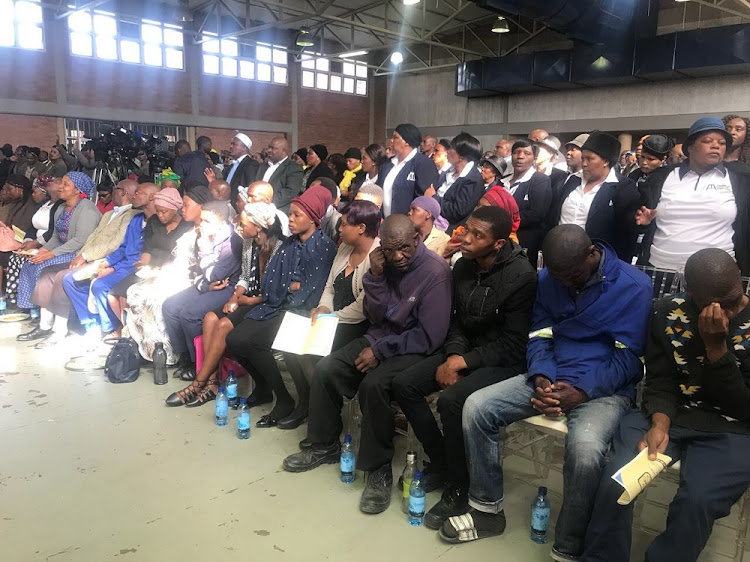 Families attending the memorial service for the 12 slain Ivory Park Association taxi operators at Rabbie Ridge Community Hall.