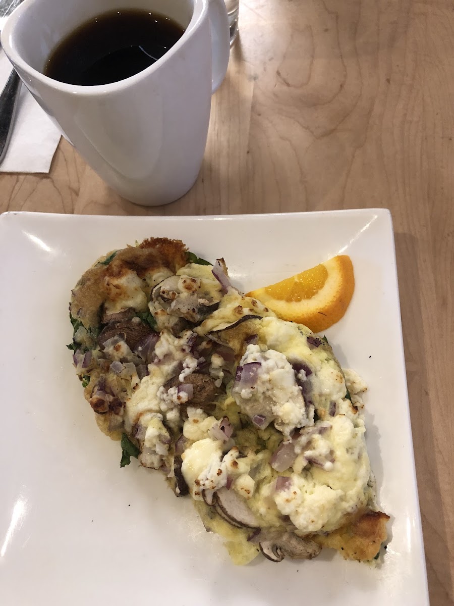 Frittata with feta, onions, mushrooms, and spinach - and a much needed cup of coffee