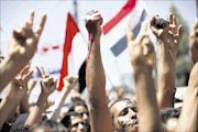 CHAOS:  Anti-government protesters shout slogans during a demonstration to demand the ouster of Yemen's President Ali Abdullah Saleh in Sanaa on Sunday.  PHOTO: REUTERS