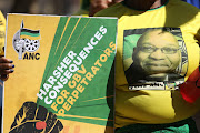 Former president Jacob Zuma's image was on a T-shirt worn by one of the ANC supporters at court in Krugersdorp on Thursday.